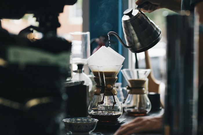 Coffee being prepared at a cafe counter
