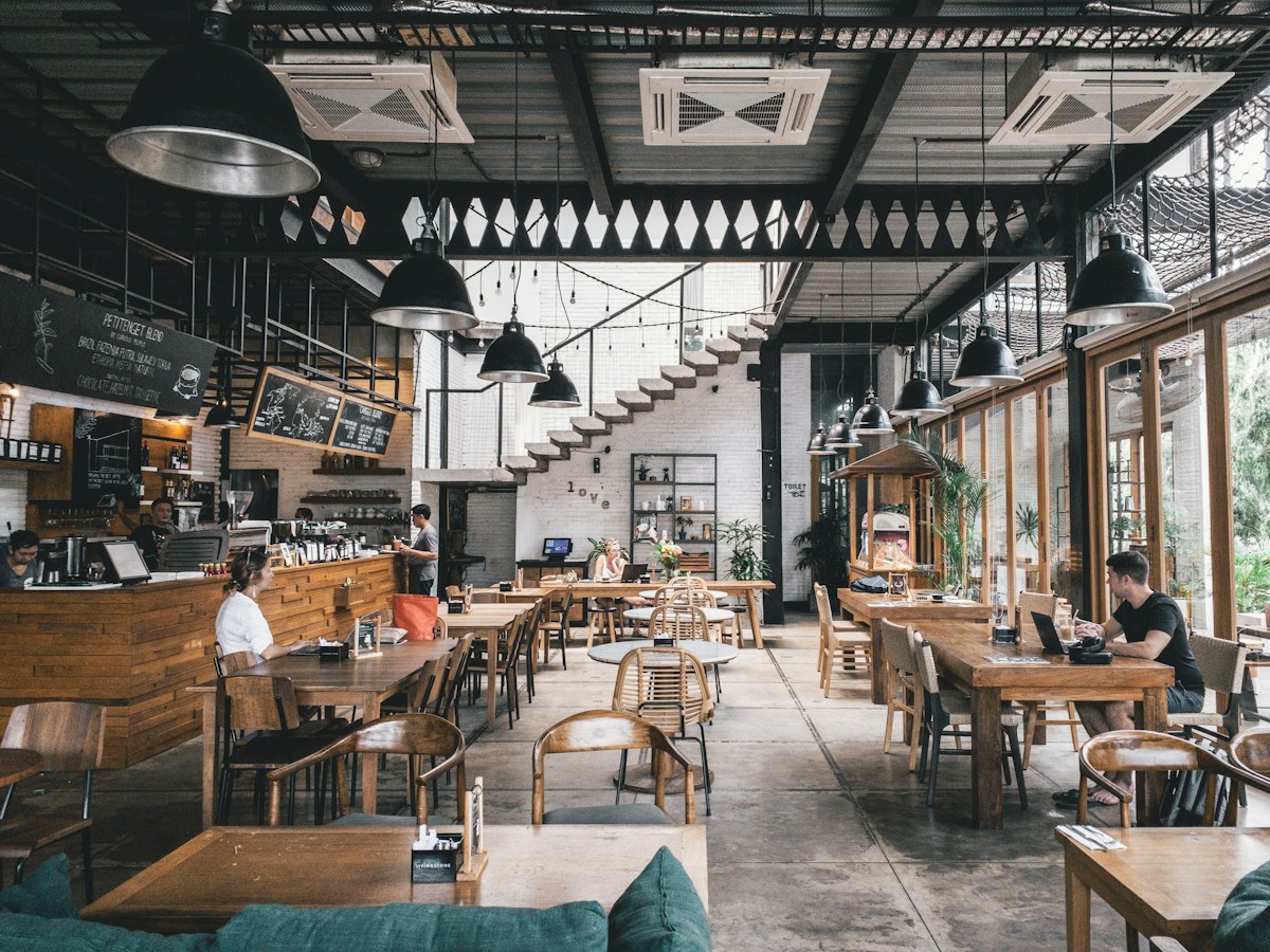 A bright, welcoming restaurant with wood tables and an open dining area